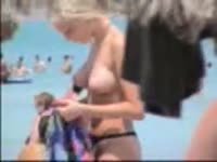Voyeur with an appetite for an exposed teen finds this naked trollop on a pretty public beach